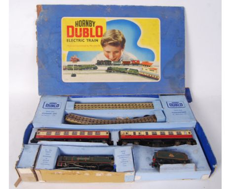 A vintage Hornby Dublo 00 gauge railway set. Within the original box. Featuring the Duchess Of Montrose locomotive, with trac