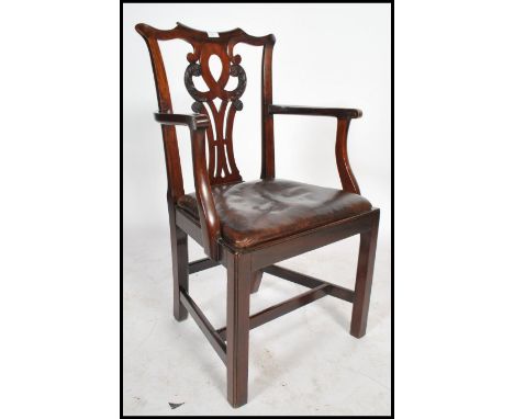 A 19th century mahogany and leather Chippendale office desk chair. Raised on squared legs with h-stretchers having drop in ta