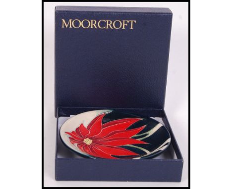 A Moorcroft ceramic tube lined pin dish coaster decorated in the Scarlet pattern with impressed marks and painted marks to ba
