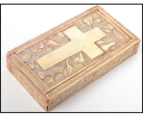 A 19th century Georgian Napoleonic prisoner of war bone snuff box with a carved depiction of a cross. Measures 6cm long.&nbsp