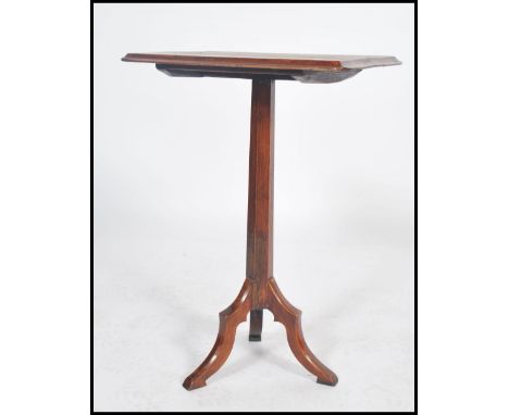 A 19th century oak ecclesiastical tripod table. Of oak construction, hexagonal column with chamfered edge rectangular top.&nb