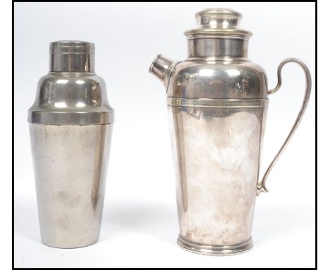 A vintage 20th century art deco Harrods of London white metal cocktail shaker along with another cocktail shaker of form.