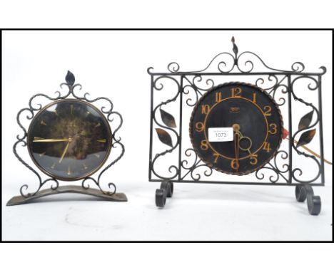 A vintage retro 20th century Junghans clock having a hammered base along with a Smiths clock having a pierced and scrolled mo