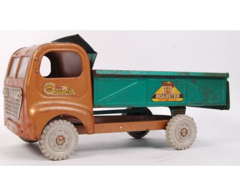 A large vintage brown &amp; green tin Triang Regal Roadster tipper truck with grey plastic wheels &amp; windscreens. Measures