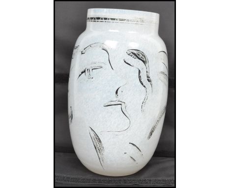 A vintage 20th century Kosta Boda studio glass face vase having a painted face design with etched number to base 48734 by Ulr