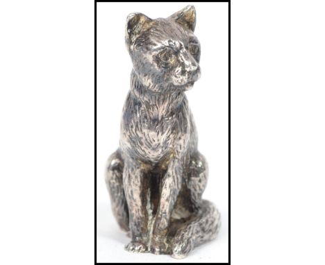 A vintage 20th century silver plated miniature figurine of a wild cat bearing makers marks to base R H in a crown. Weighs 313