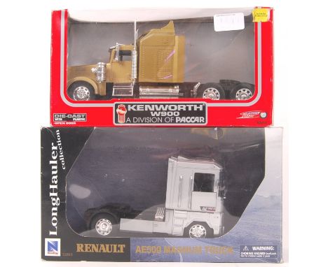 Two 1:32 scale precision diecast model truck cabs. Power Speed model Kenworth W900 Paccar and a NewRay Renault AE500 Magnum T