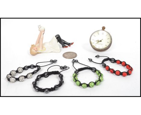 A ladies contemporary bone bangle together with a pocket ball clock, ceramic figurine and a bracelet etc ( see images ). High