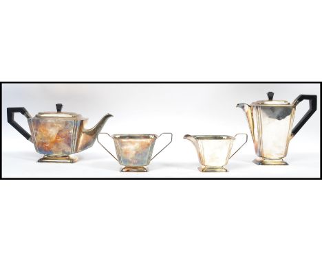 An art deco silver plated tea service of angular form with ebonised handles consisting of teapot , water pot ,&nbsp;creamer ,