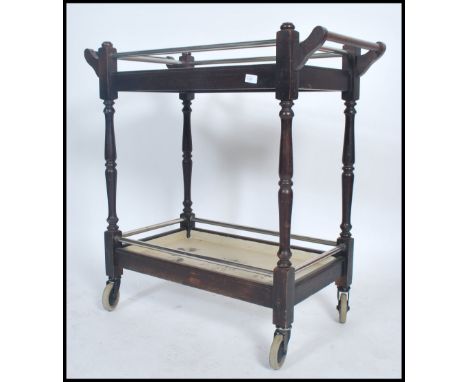 A 20th century&nbsp;two tier&nbsp;tea / service&nbsp;/ dinner buffet serving&nbsp;trolley being stained and painted with peri