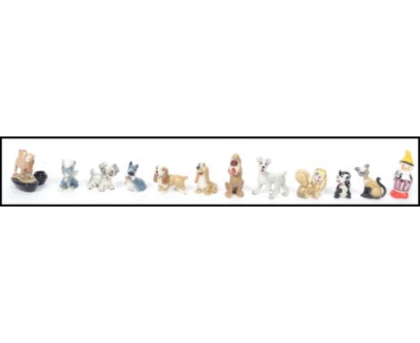 A collection of vintage 20th century Wade ceramic Disney figures to include Lady and the Tramp, Bambi etc along with a camel 