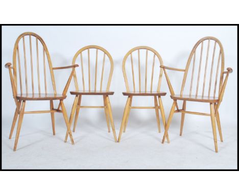 A pair of Ercol Golden Dawn coloured beech and elm framed Windsor, high hoop, spindled back carver dining chairs with solid s
