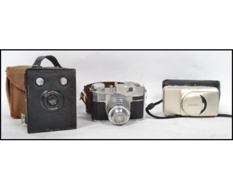 A vintage mid 20th century cased Comet 5 35mm camera together with a vintage cased brownie Jnr and another camera.