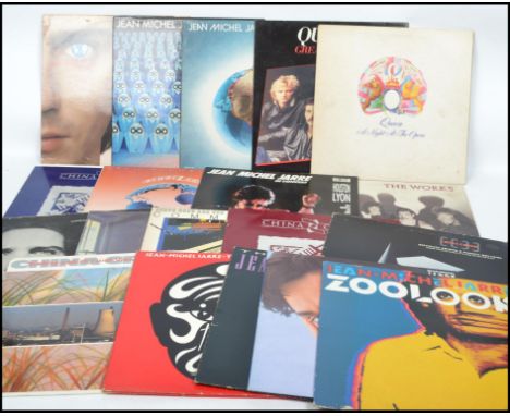 A collection of vintage long play LP vinyl record albums pertaining to Queen, Jean Michel Jarre and China Crisis, all differe