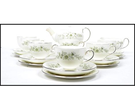 A vintage 20th century Wedgwood six person tea service in the Westbury pattern to include the teapot, cups, saucer, plates, s