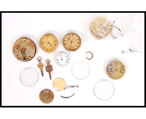 A collection of vintage 19th and 20th century pocket watch movements and spares to include cases dust covers, keys etc. Pleas