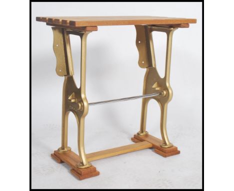 An upcycled 20th century set of cast vintage cinema cast metal chair frames having a painted gilt finish surmounted with wood