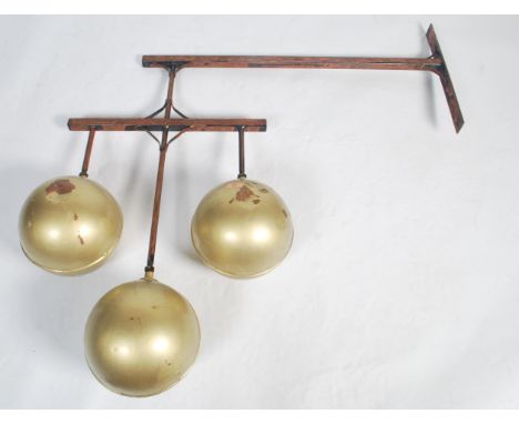 A 20th century original shop point advertising pawn balls - Pawn Shop Sign. Raised on the exterior wall bracket having three 