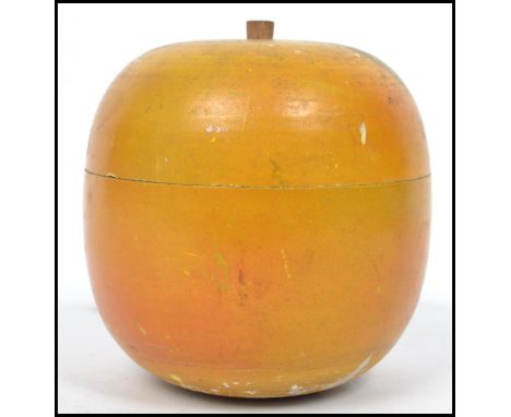 A 19th century turned / treen fruit wood tea caddy in the form of an apple. Measures 10 cm high.