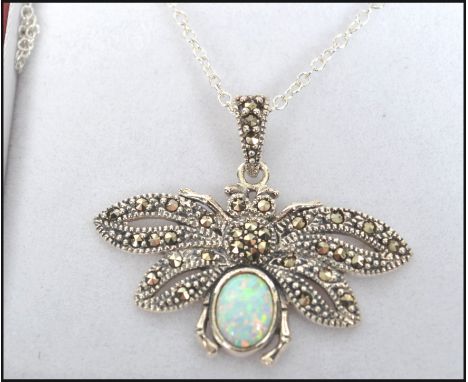 A contemporary ladies silver marcasite and opal pendant necklace in the form of a butterfly and set to a chain. Measures 18 i