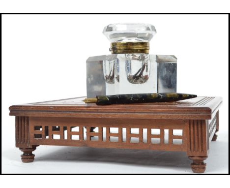 A stunning Victorian 19th century desk top mahogany aesthetic movement oversized ink well, the oversized cut glass inkwell wi