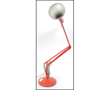 A vintage 20th century retro Herbert Terry 90 anglepoise desk lamp in red with circular base and pendant shade. Measures 92 c