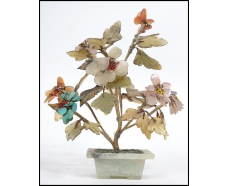An Oriental Chinese model of a bonsai plant constructed from semi precious stones to include jade, carnelian, turquoise etc. 