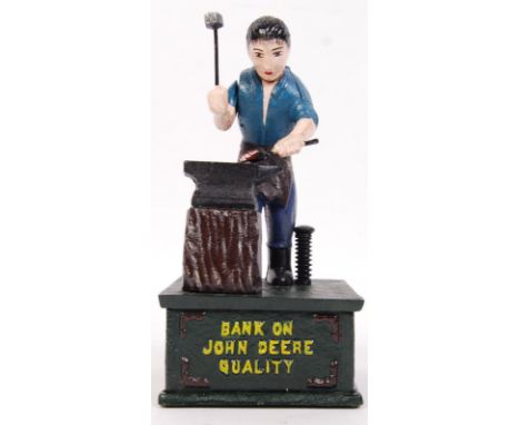 A 20th century vintage style cast iron John Deere money bank. Measures approx 24cm tall.&nbsp;