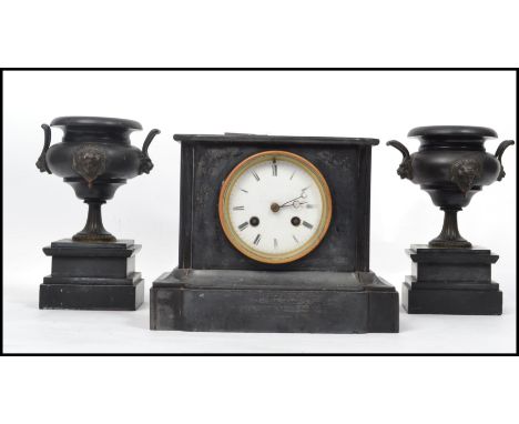 A 19th century Marti French black marble slate mantle clock and garniture set having a white enamel face with roman numeral c