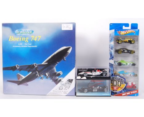 A collection of assorted transport related diecast models comprising of; 2x Minichamps F1 Formula One racing cars (within the