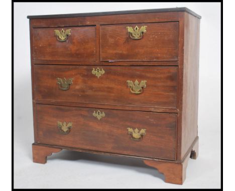 A 19th century mahogany batchelors chest of drawers, two over two cockbeaded drawers with swag brass handles raised on&nbsp;s