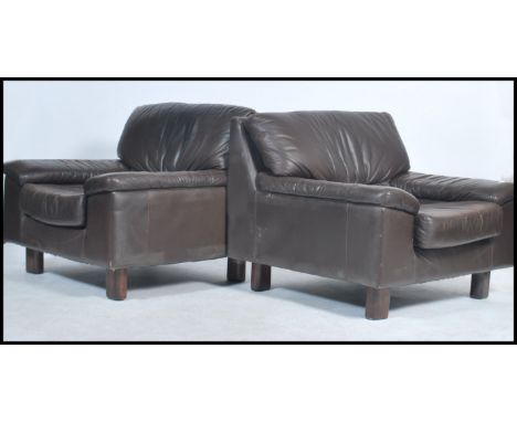 A pair of vintage 20th century original Tetrad retro leather brown armchairs raised on squared supports with angular frames u