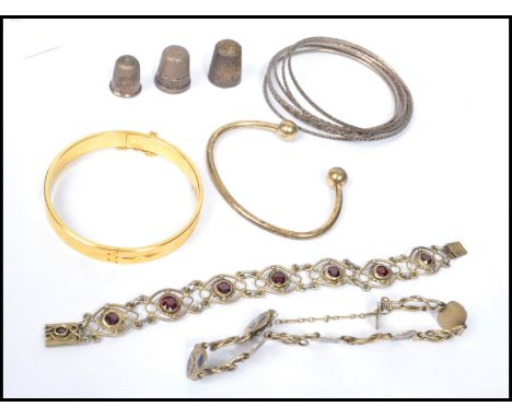 A group of vintage silver, rolled gold and other jewellery to include an 18ct rolled gold bangle, various silver hammered ban