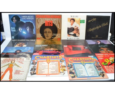 A collection of 1970's vinyl long play lp records to include The Carpenters, Abba, etc. contained within a vintage vinyl carr