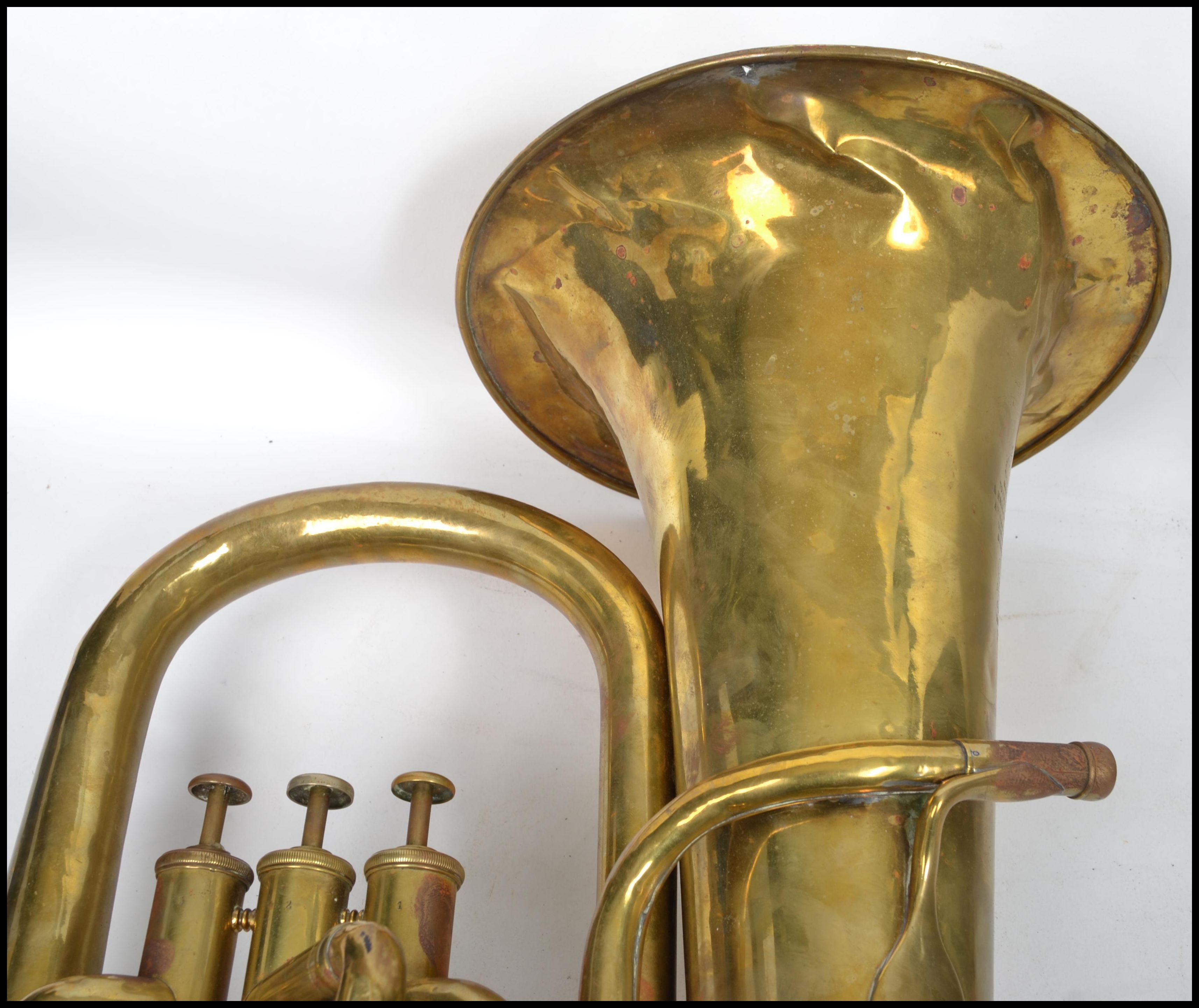 A vintage 20th century brass tuba musical instrument by A Hall Gisborne