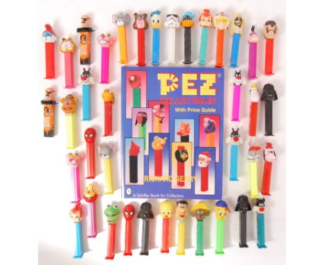 A collection of assorted vintage Pez dispensers - various forms - to include Star Wars, Flintstones, Batman, Looney Tunes and