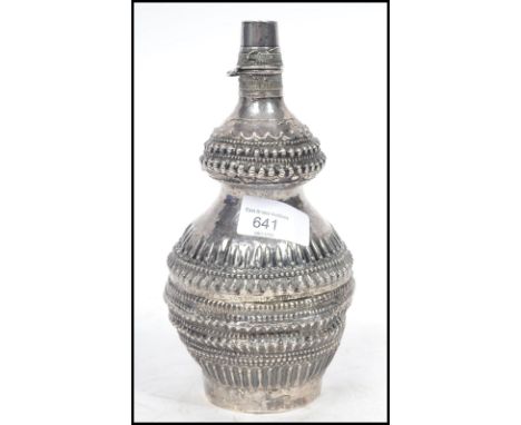 A 19th century Chinese silver drinking flask of bulbous form, the globular body of Gu shape having gadrooned decoration with 