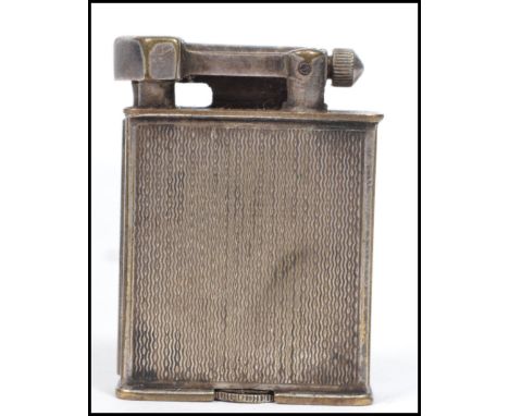 A vintage 20th century Parker The Beacon Roller lighter having an engine turned design. Measures 5 cm high, 4 cm wide and 1.5