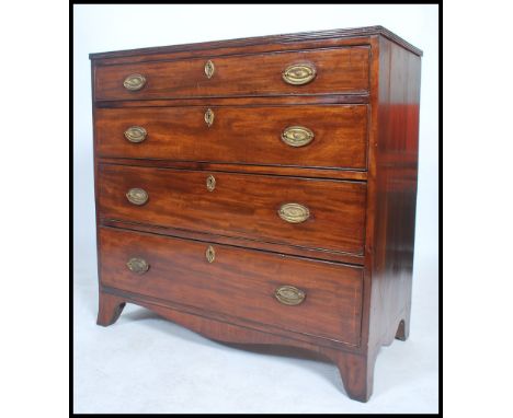 A 19th century Georgian mahogany chest of drawers being raised on bracket feet with a set of 4 graduating drawers having bras