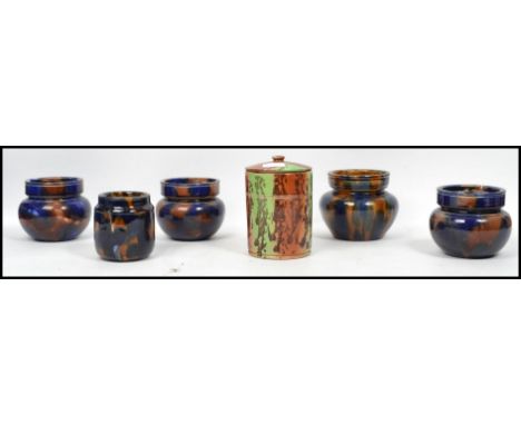A good group of 19th century Victorian splat ware ceramic tobacco jars with lids having a tortoise shell type decoration. Hig
