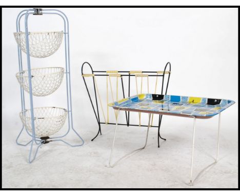 A group of vintage retro 20th century items to include a Prestige three tier vegetable display rack, a 1960's wire magazine r