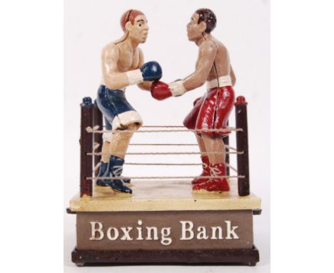 A 20th century vintage style cast iron Boxing Bank with boxers in ring. Measures approx 21cm tall.&nbsp;