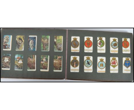 A vintage 20th century cigarette card album containing various sets to include flowers, shipping etc. Please see images. Meas