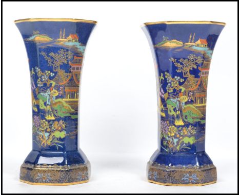 A pair of Carlton Ware vases in the Mikado pattern no. 2364, printed and painted in colours and gilt on a mottled blue ground