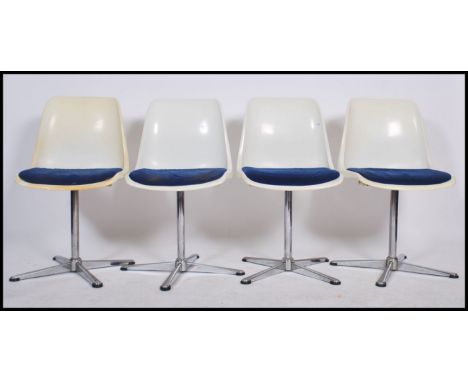 A set of four Swivel chairs / dining chairs marked for Centa&nbsp;designed by Oskar&nbsp;Winkler , the chairs having a white 