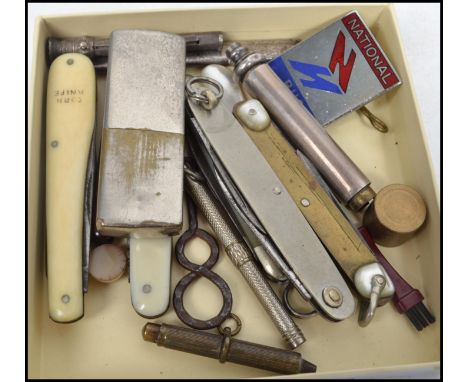 A group of vintage 20th century curious to include various pen knives, lighter, pin badge, silver pencils, etc. Please see im