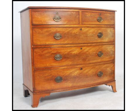 A 19th century mahogany and crossbanded bow front chest, containing two short over three long drawers, on swept bracket feet,