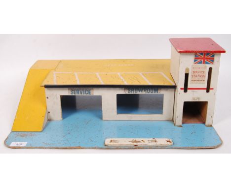A vintage likely Britains wooden service station play set with carpark &amp; wooden winding car lift. Missing petrol pumps. M
