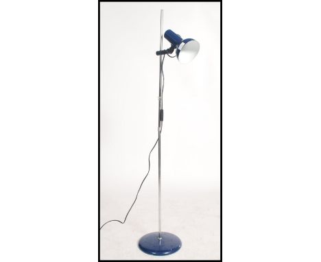 A retro 20th century floor standing floor lamp / light, raised on a blue circular base with an adjustable chrome tubular body