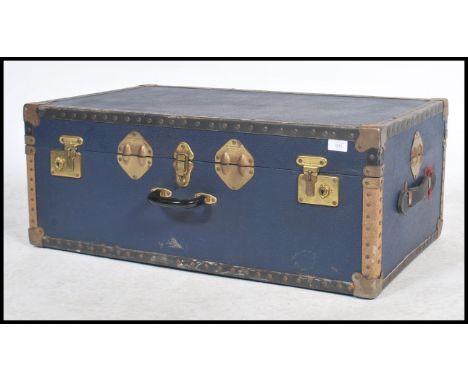 A vintage 20th century steamer trunk, hinged lid studded detail finish and in the original blue.&nbsp;Measures: 40cm high x 7